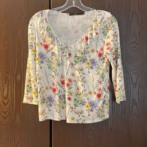 Hazel 3/4 sleeved white top with multi-colored floral pattern. Size Small